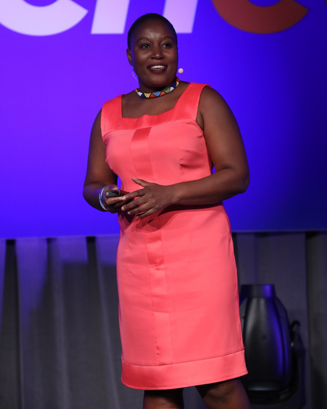 Thembi Bheka speaking on stage